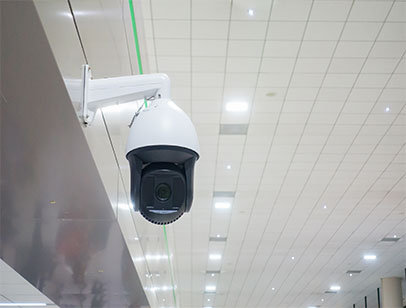 A surveillance camera is installed in the commercial building.